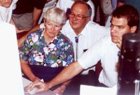 Gene and Carolyn Shoemaker watch as the first collision photos arrive 